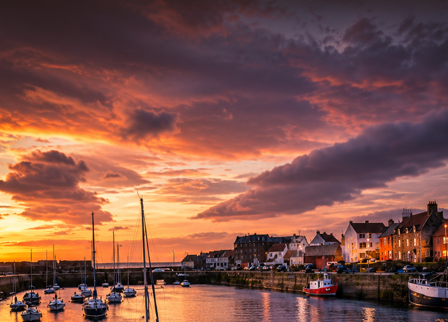 Dunbar harbour at sunset — the Scottish coastal setting of The Road to Dunbar